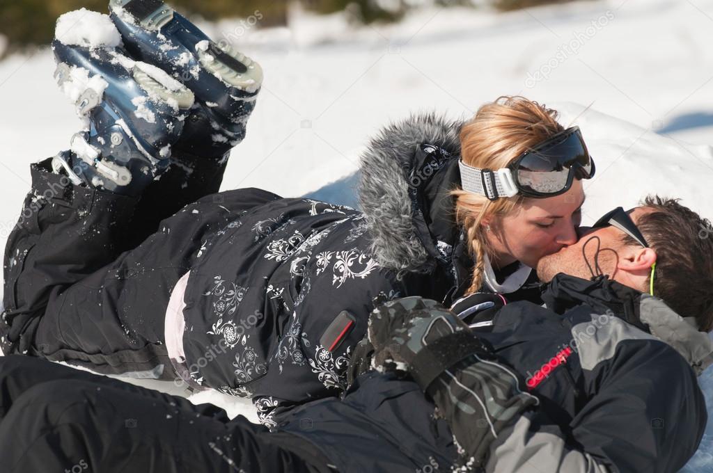 couple in love kissing on snow