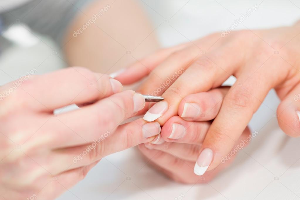 Removing cuticle procedure — Stock Photo © microgen 115191514