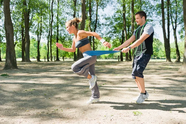 Running with resistance band — Stock Photo, Image