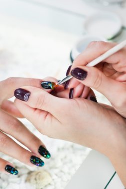 Nail salon manicurist working clipart