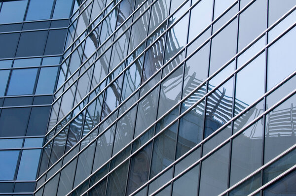 Reflections on a modern office building facade
