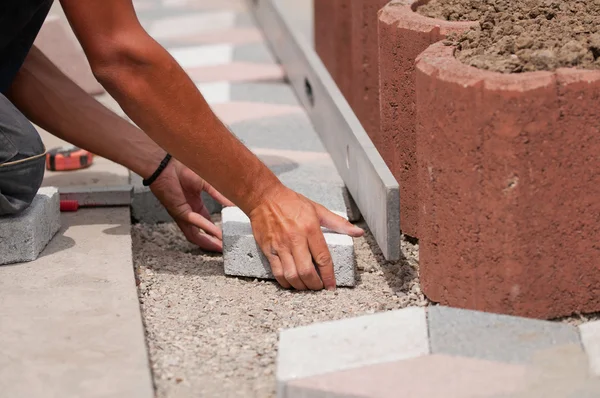 Laying street tiles — Stock Image Laying street tiles Royalty Free Stock Photos