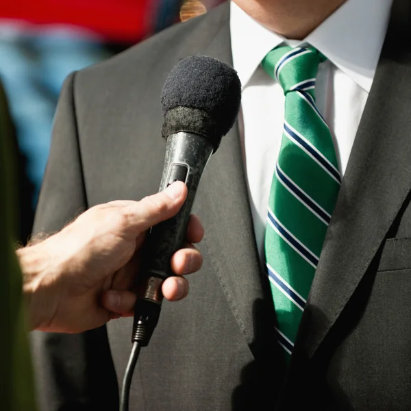 TV reporter interviewing businessman — Stock Photo, Image