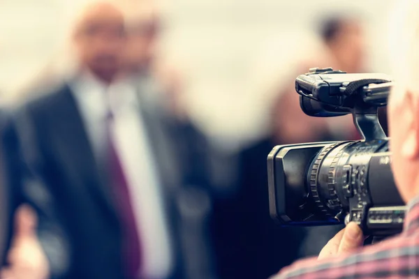 Cameraman recording conference — Stock Photo, Image