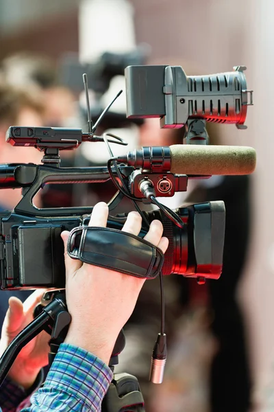 cameraman with  recording equipment