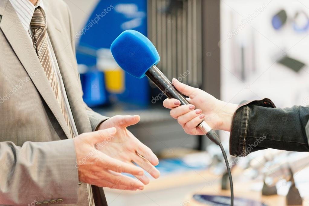 TV reporter interviewing businessman
