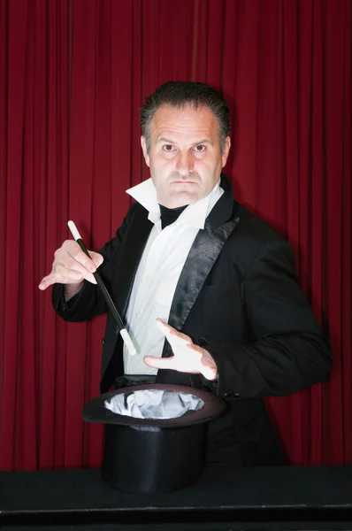 Magician performing on stage — Stock Photo, Image