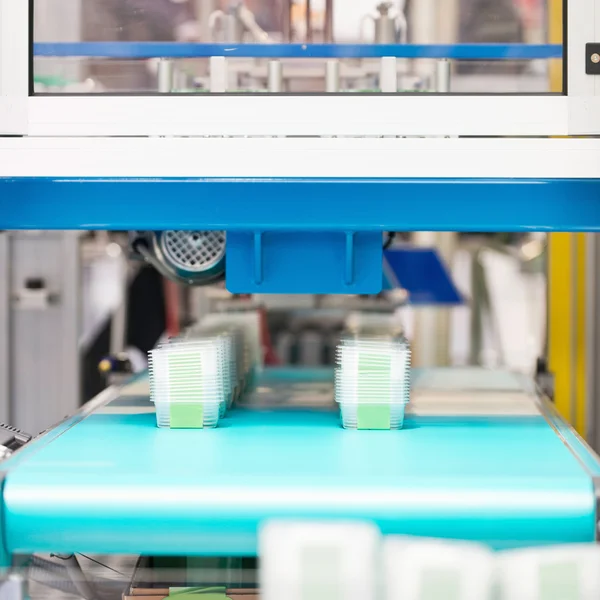Plastic containers production — Stock Photo, Image