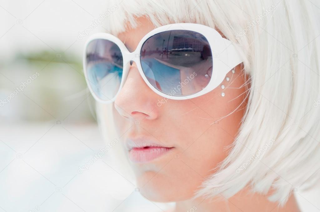 Girl with white sunglasses