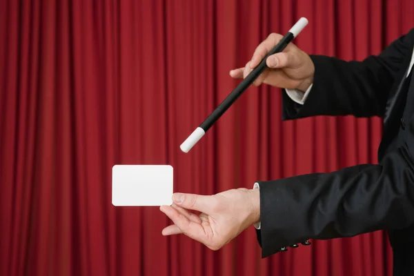 Stage magician using magic wand — Stock Photo, Image