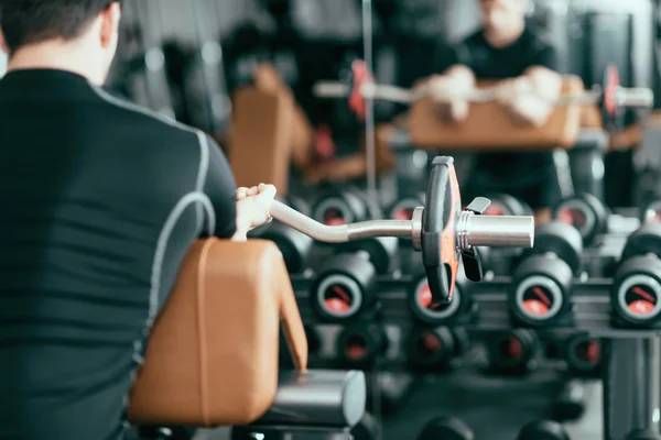 Man working out with barbell weights — Stock Photo, Image