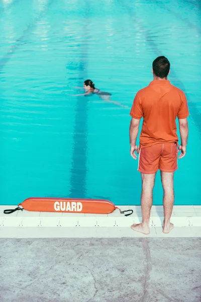 Lifeguard standing on duty — Stock Photo, Image