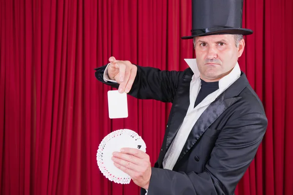 Magician performing simple trick — Stock Photo, Image