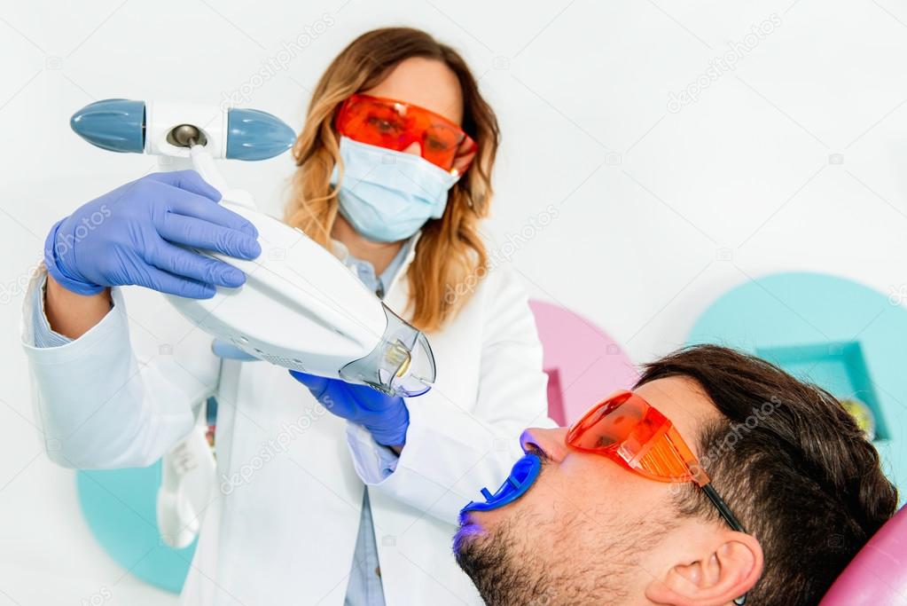 Laser teeth whitening procedure — Stock Photo © microgen 115617850