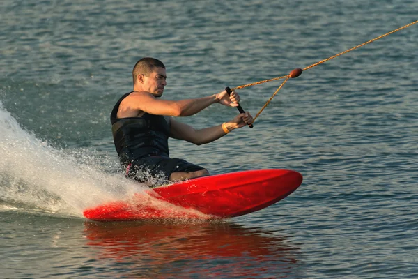 Man doing kneeboarding stunt — Stock Photo, Image