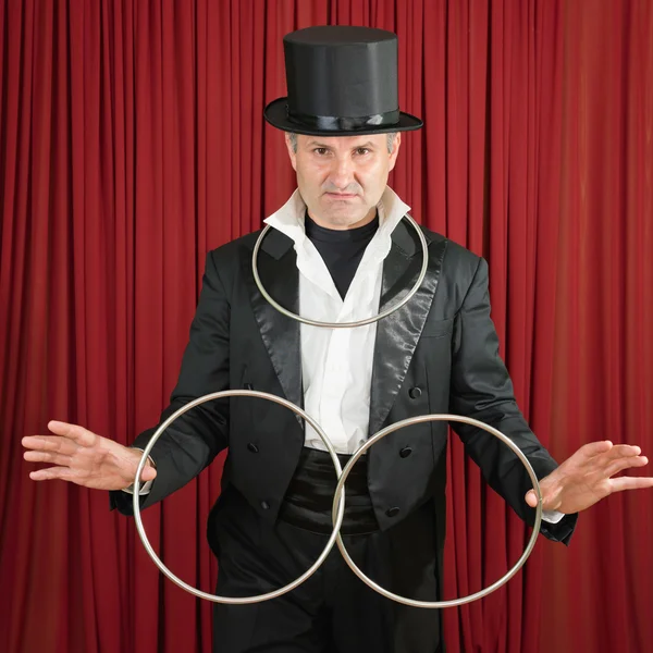 Magician with classic metal rings — Stock Photo, Image
