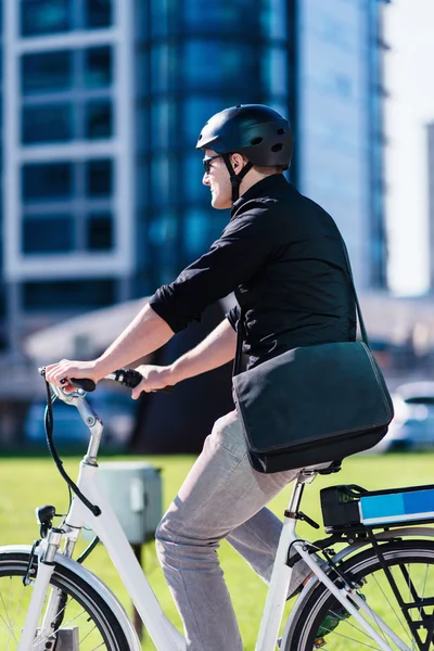 Businessman on electric bicycle — Stock Photo, Image