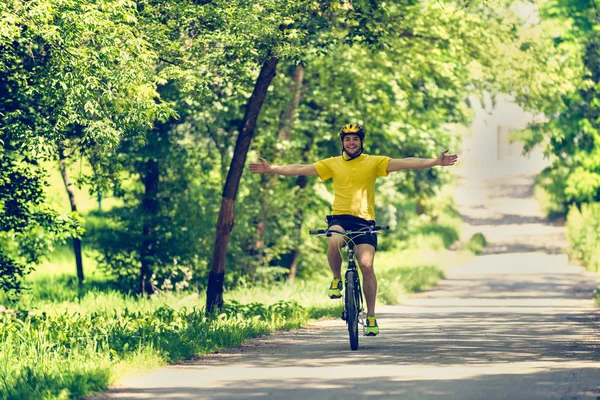 Cheerful man riding bicycle — Stock Photo, Image