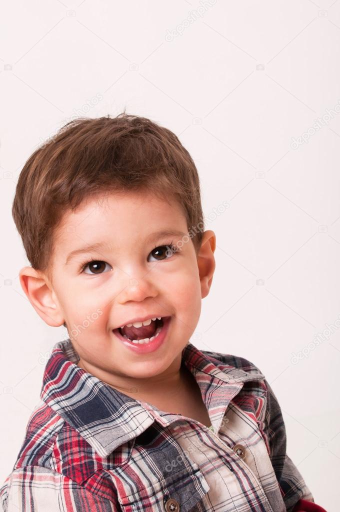 boy looking up and smiling with opened mouth