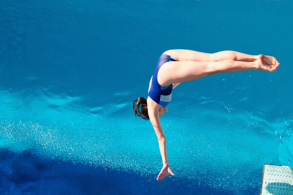 diver jumps off springboard