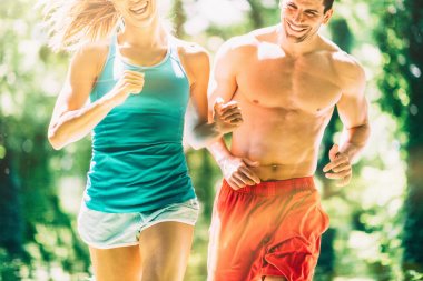 Competitive young couple runners  clipart