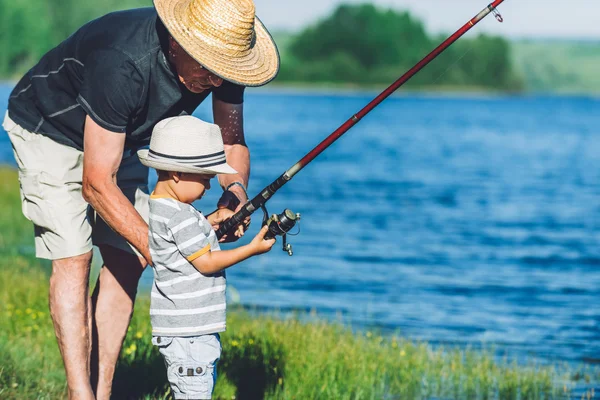 Grandfather with grandson fishing — Stock Photo, Image