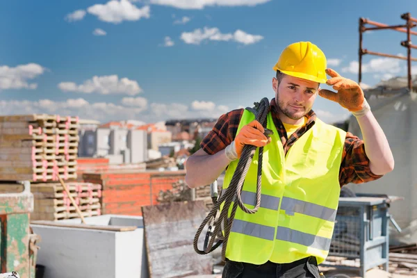 Construction worker with cable — Stock Photo, Image