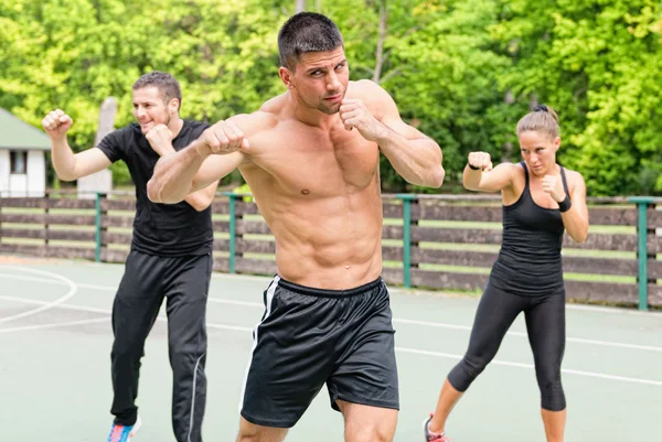 Tae Bo athletes training outdoor — Stock Photo, Image