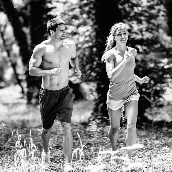 Crossfit pareja atlética trotando —  Fotos de Stock