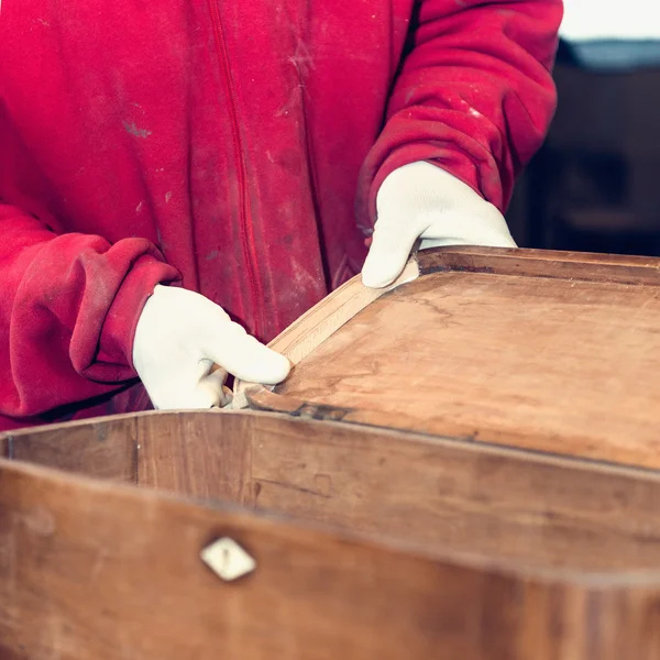 Carpenter restoring old furniture — Stock Photo, Image