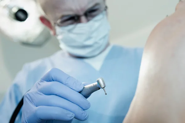 Senior male dentist with drill — Stock Photo, Image