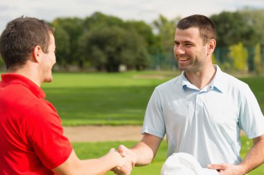 Golfers shaking hands clipart