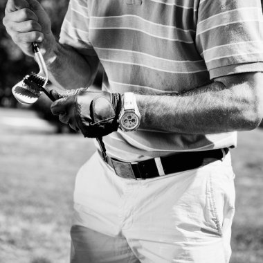 Golfer cleaning iron golf club clipart