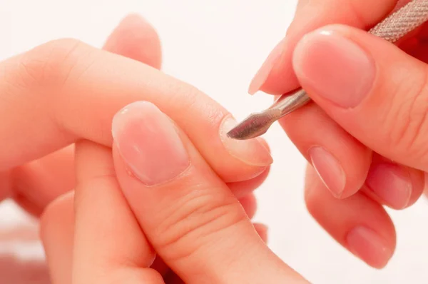 Removing cuticles at salon — Stock Photo, Image