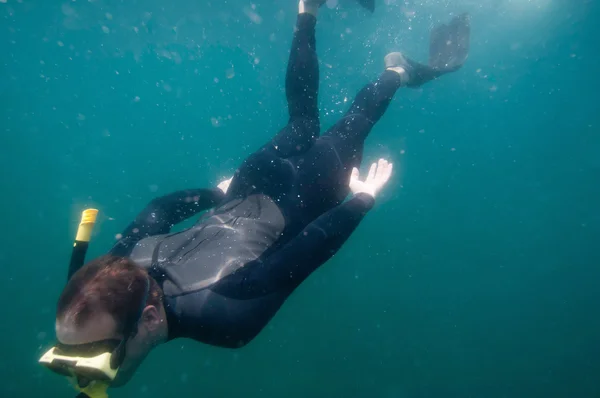 Free diver speeding through water