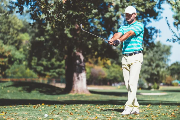 Golfer planing ball trajectory — Stock Photo, Image