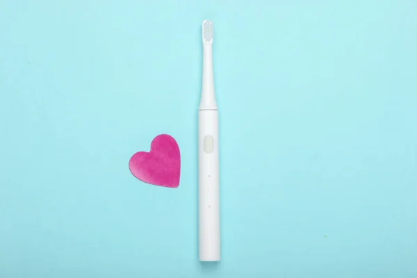 Electric Toothbrush Decorative Heart Blue Background Oral Care Top View — Stock Photo, Image