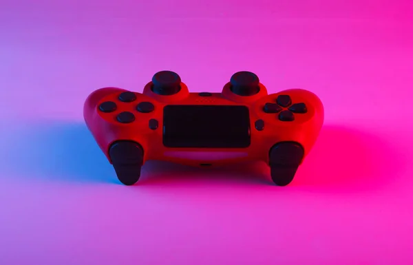 Gamepad with neon blue-pink light. Gaming concept.