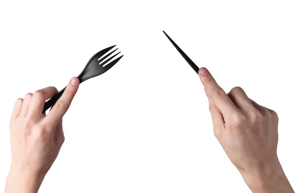 Las Manos Femeninas Sostienen Cuchillo Plástico Negro Con Tenedor Aislado —  Fotos de Stock