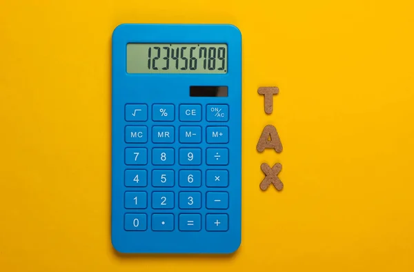 Calculator Word Tax Yellow Background Top View — Stock Photo, Image