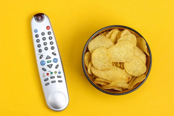 Movie Time Remotes Bowl Chips Yellow Background Top View — Stock Photo, Image