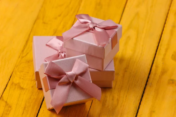 Gift Boxes Bows Yellow Wooden Background — Stock Photo, Image