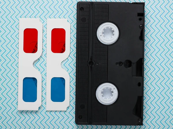 Retro 80S Paper Stereo Glasses Video Cassette Blue Pastel Background — Stock Photo, Image