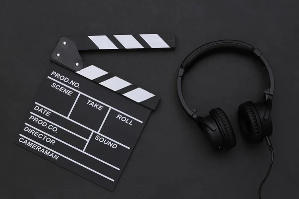 Movie Clapperboard Stereo Headphones Black Background Top View — Stock Photo, Image