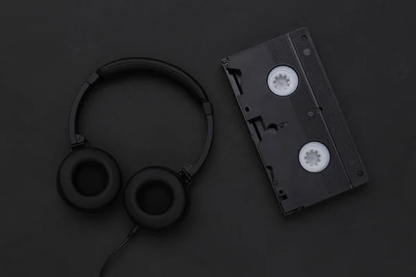 Stereo Headphones Video Cassette Black Background Top View — Stock Photo, Image