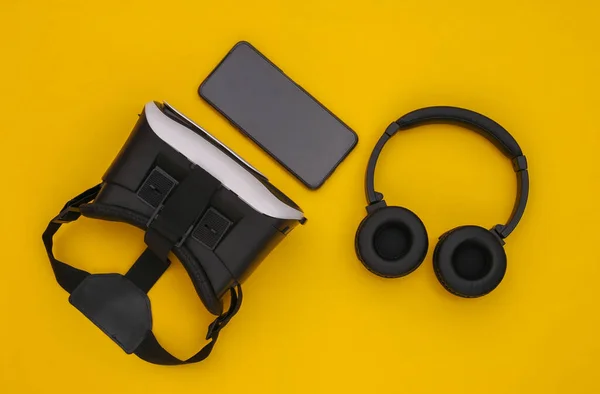 Flat Lay Composition Modern Gadgets Helmet Headphones Smartphone Yellow Background — Stock Photo, Image