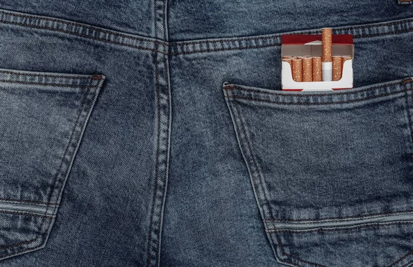 Pack of cigarettes in the back pocket of jeans