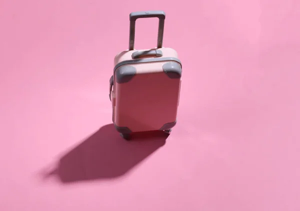 Travel Minimalism Mini Plastic Travel Suitcase Pink Background Deep Shadow — Stock Photo, Image