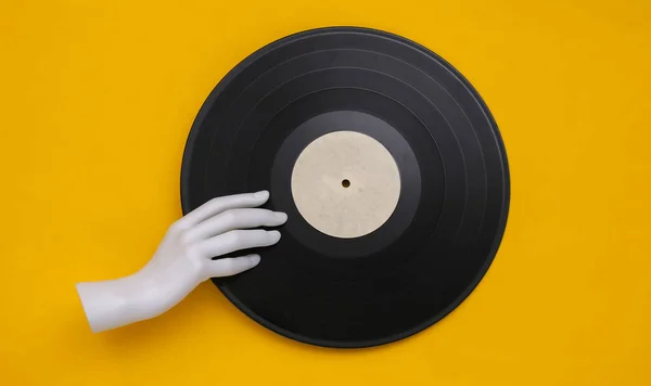 Mannequin White Hand Holding Vinyl Record Yellow Background Vista Superior — Foto de Stock
