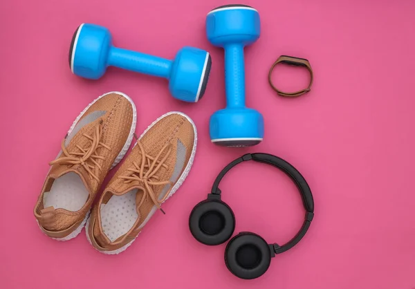 Sports Shoes Dumbbells Stereo Headphones Smart Bracelet Pink Background Getting — Stock Photo, Image